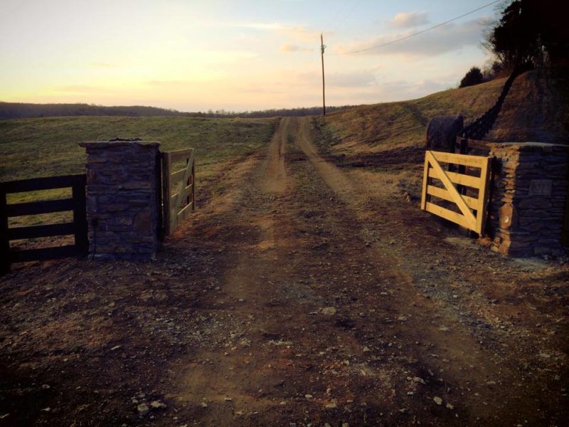 Wood driveway gate by Pro-Line Fence Co. LLC