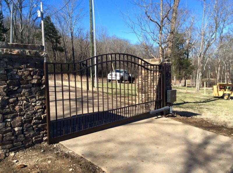 Pro Line Fence Co. installs a unique aluminum gate with an operator for automatic entry