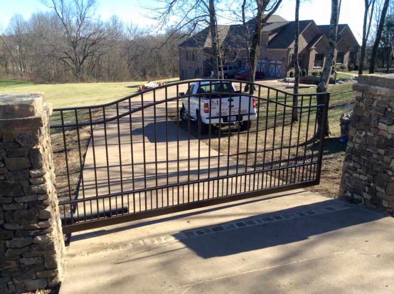 Driveway automatic fence by Pro-Line Fence Co. LLC